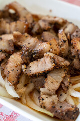 Delicious Taiwanese salted pork food with onion in restaurant.
