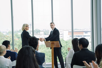 Business people shake hands after successful presenting analytical report and meeting in the office.