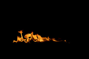 Abstract blaze fire flame texture for banner background.Texture of fire flames  on a black background. Real fiery bonfire for creative design elements