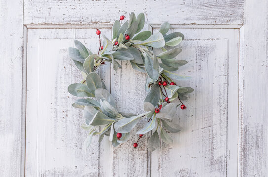 Lamb's Ear with red berries wreath on white antique door