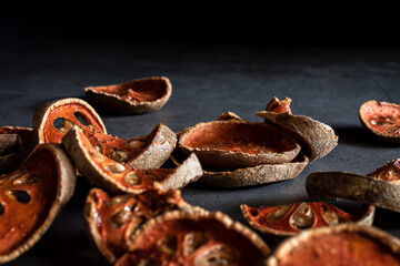 Dried quince on a black marble table