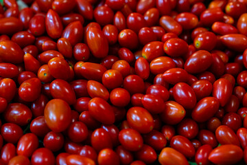 Food backgrounds. Fresh tomatoes in a basket. Queen Tomato.