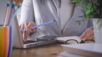 working at home, smart working.  Girl uses more technological device for communicate and work.