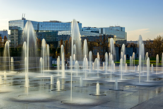 Paris, France - December 04 2019: Parc Andre Citroen water jets fountain in late Autumn. Long exposure shot.