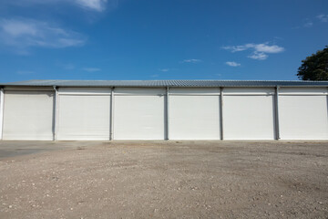 Fototapeta na wymiar Storage units with roller shutter doors in industrial area