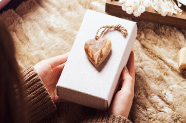 Valentines gift concept. Female hands holding gift box.