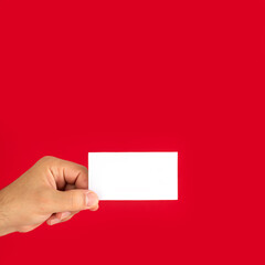 Man showing blank white business card isolated on red background