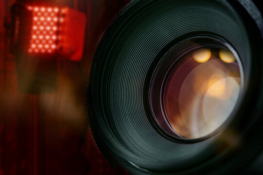 closeup of lens of dslr camera in studio with blurred background