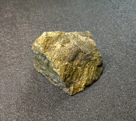 the mineral is a stone chip with yellow inclusions