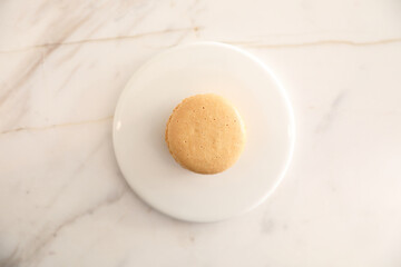 brown macaron dessert in coffee shop background