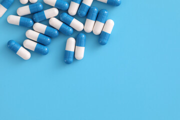 pills capsules isolated on blue background