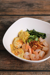 Shrimp dumpling with shrimp on wood background