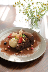 Chocolate cake with ice cream dessert on wood table