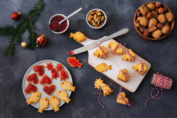 Baking Christmas cookies. Dark background table.