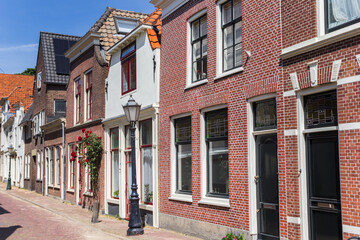 Street with old houses in the historic center of Gouda, Netherlands