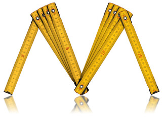 Yellow old wooden folding ruler in the shape of letter M. Meter, unit of length. Isolated on white background with reflections.