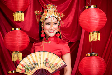 Action portrait beautiful Asian girl wearing Cheongsam. the celebration of something in a joyful and exuberant way. Festivities and Celebration concept