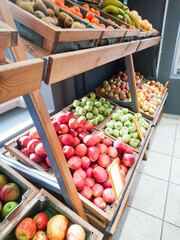 Fruit market or shop with various colorful fresh fruits and vegetables