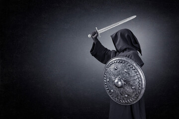 Ghostly figure with sword and round shield in the dark
