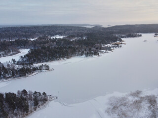 Aerial view of the frozen strait Markatsimansalmi on the winter Lake Ladoga. Sortavala, Karelia.