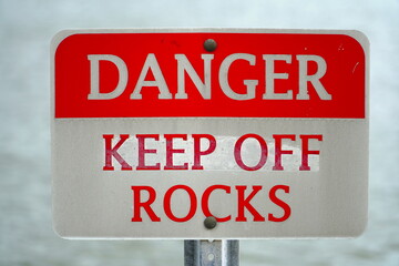 Warning sign DANGER: KEEP OFF ROCKS