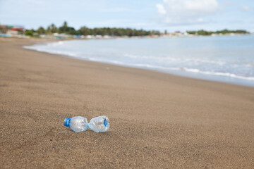 Fototapeta na wymiar Plastic bottle on the beach.