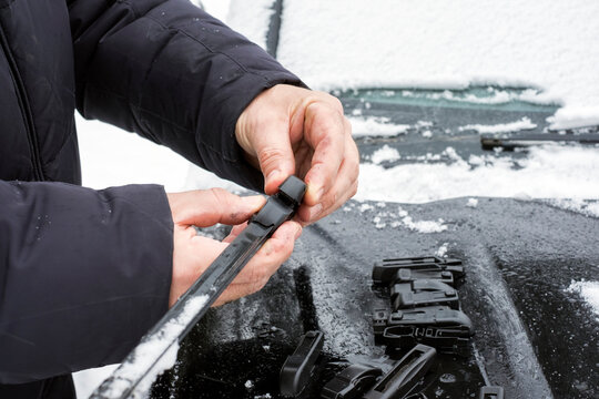 Man Replacing Wiper Blades