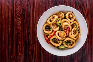 Spicy fried squid with basil leaves