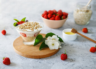 A dietary dessert made from oatmeal and fresh strawberries. Delicious healthy, light breakfast. Panna Cotta. Granola with yoghurt. The right sweets. Vegetarian sweets