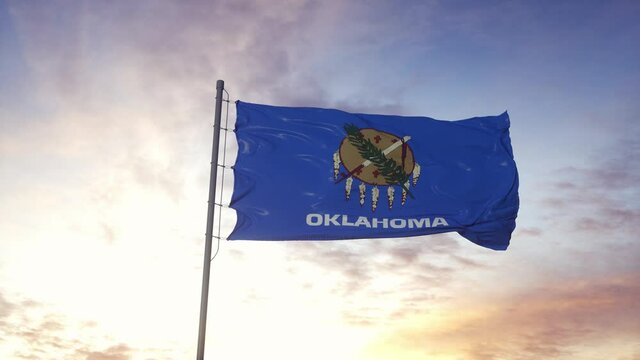 State flag of Oklahoma waving in the wind. Dramatic sky background. 4K