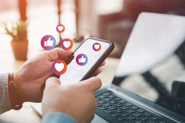 Social media and digital online concept, man using smart phone with Social media. The concept of living on vacation and playing social media. Social Distancing ,Working From Home concept.