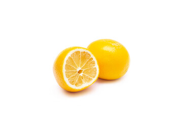 Half a ripe yellow lemon and a whole lemon isolated on a white background. Lemon in a cut