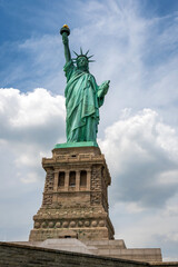 Statue of Liberty on Liberty Island closeup with blue sky in New York City Manhattan 