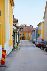 street in the old town country. Street in a small town in Sweden. Colorful houses on a street in Sweden. Swedish architecture. Colorful wooden houses 