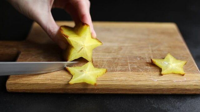 carambola star fruit cut into slices on the table for healthy meal snack outdoor top view copy space for text food background rustic