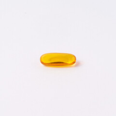 Fish oil tablet on white background.