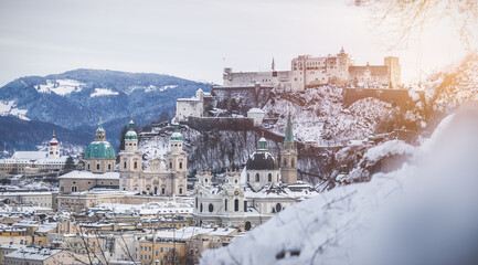 Fototapeta na wymiar Panorama of Salzburg in winter: Snowy historical center and old city, sunshine