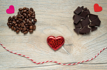 Valentine's day smile made from chocolate and roasted coffee beans on an Oak like wooden background.