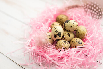 Obraz premium Easter. Peepeline eggs in a pink nest. White background.
