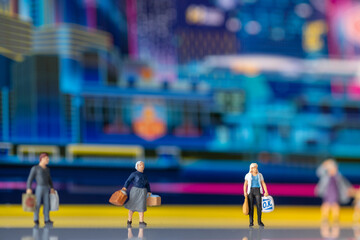 Miniature people : Tourists and shoppers stand behind the scenes of the technology city.