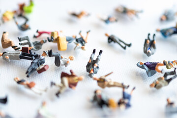 Miniature people : A lot of people sleeping on a white background