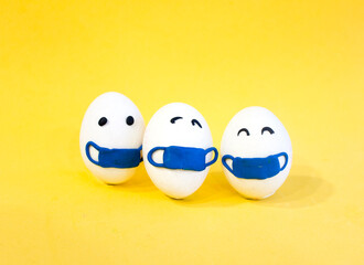 Chicken eggs in medical masks on the face. The concept of the Easter 2021 holiday in relation to...