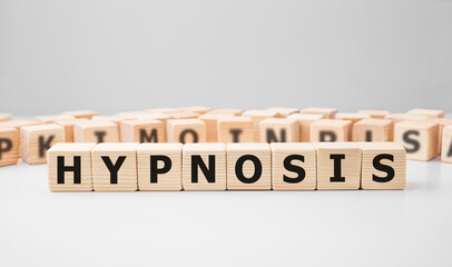 Word HYPNOSIS made with wood building blocks