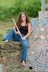 Woman with her flute outdoors © dfriend150