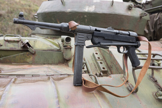 German  submachine gun on the armor of the tank
