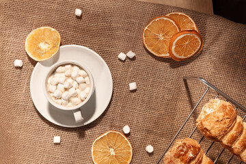 composition of Fresh cream puff cones, coffee and marshmallows. Coffee flavor for breakfast