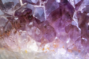 Macro closeup of amethyst cluster, selective focus, texture of gemstone, rhinestone, quartz crystal...