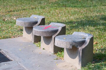 Park seats are marked with distances to reduce COVID-19 infection in parks.