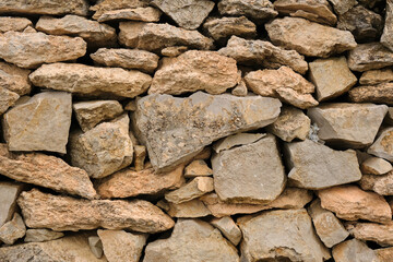 Wall made of stones and rocks. Stones texture background