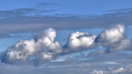 Grey and blue clouds in the sky in winter. Wind clouds
